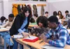 IRF, settling-in talk, interruptions and timings Female teacher with two male students