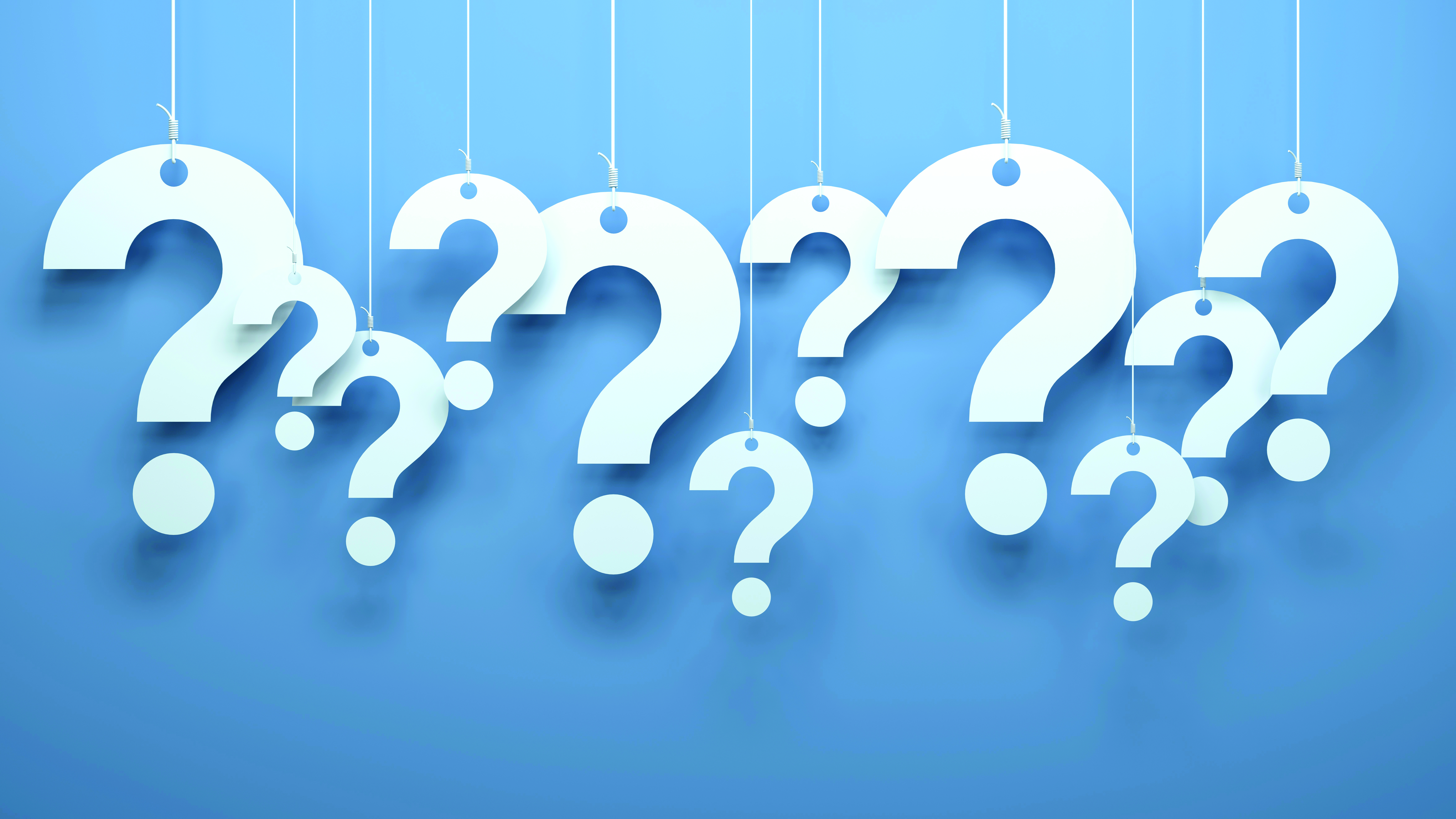 How can we encourage learners to ask better questions? Several large white question marks hanging by strings against a light blue background.
