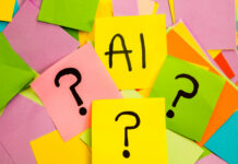 Are we asking the wrong questions about using AI? A collection of colourful sticky notes with question marks and "AI" written on them.