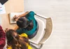 Digital age lifelong skills aerial view of students on a laptop