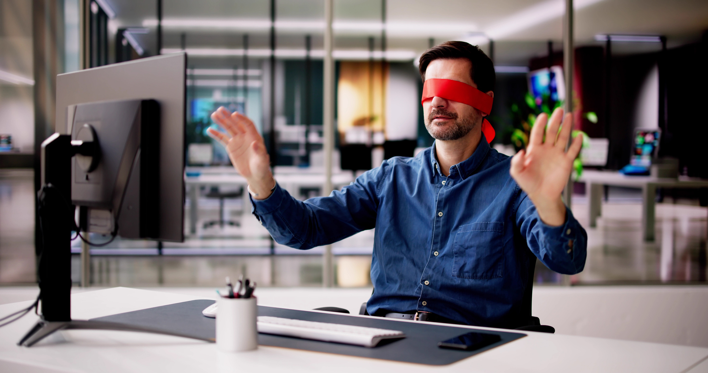 Confused Blindfolded Man Concept. Office Worker Using Computer