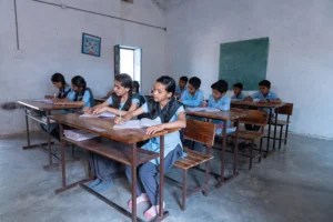 children at desk in classroom