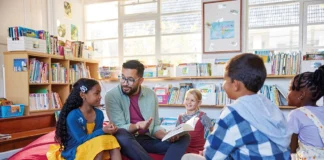 Once upon a time there was… children sitting on beanbags with teacher reading