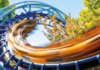 The emotional rollercoaster of being a teacher educator A roller coaster with a blue track and vibrant yellow cars, captured in motion as it loops through a lush green area, creating a blur effect.
