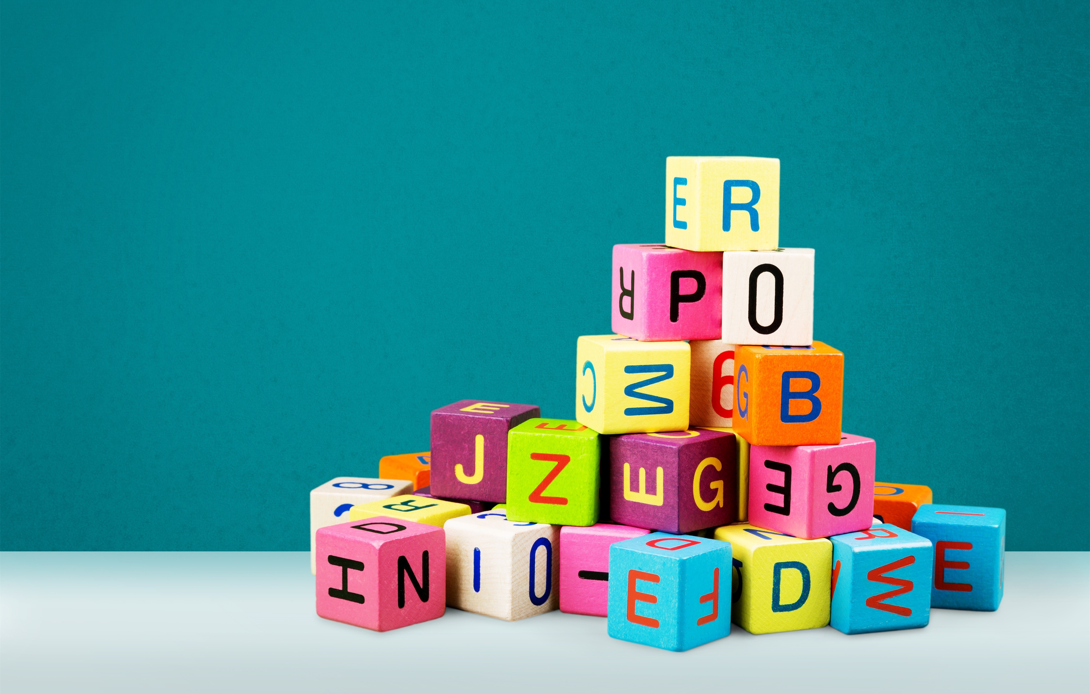 Toys collection on wooden table with blurred background