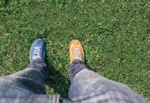 Moving away from becoming perfectly polished professionals to training and teaching with professional vulnerability looking down at odd shoes on grass