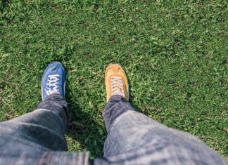 Moving away from becoming perfectly polished professionals to training and teaching with professional vulnerability looking down at odd shoes on grass