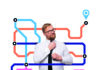 Exploring the classroom Man adjusting his tie with a background of colourful, intersecting lines resembling a metro map.