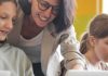 12 things we wish we had known when we started teaching YLs – Part 2 Teacher assisting student on laptop