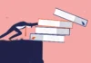 A farewell to coursebooks pushing books over edge of table