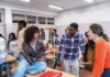 Can you give me a hand? students discussing in classroom